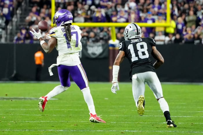 Dec 10, 2023; Minnesota Vikings wide receiver K.J. Osborn (17) makes a catch in front of Raiders cornerback Jack Jones (18). Mandatory Credit: Stephen R. Sylvanie-USA TODAY